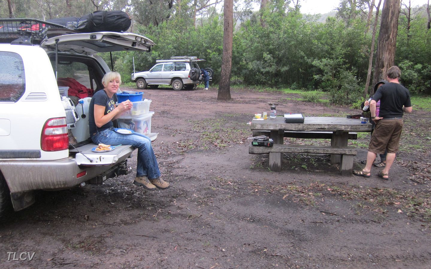 10-Andrea takes a lunch break while Gunther prepares his snack at the table.JPG
